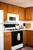 Apartment 102: Kitchen with Microwave and Gas Range